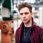 André Kaczmarczyk: The Actor Redefining Modern German Crime Drama A Performer at the Center of Germany’s Evolving Screen Culture In contemporary German television and theatre, few actors have navigated both traditional performance and modern storytelling as effectively as André Kaczmarczyk. Known for his versatility and depth, Kaczmarczyk has steadily built a career that spans classical theatre, experimental productions, and mainstream television. His recent prominence—particularly through his role as Chief Inspector Vincent Ross in Polizeiruf 110—positions him not only as a recognizable face in German entertainment but also as a figure reflecting broader cultural and narrative shifts in European media. From Eisenach to the Stage: Early Foundations Born on March 11, 1986, in Suhl, Germany, Kaczmarczyk grew up in Eisenach, where his artistic inclinations developed early. His formative years were closely tied to theatre, beginning with youth productions and performances at institutions such as the Freien Eisenacher Burgtheater and Landestheater Eisenach. His early exposure to performance was not casual—it was disciplined and continuous. Notably, he portrayed Martin Luther in a historical open-air festival shortly after completing his secondary education, signaling both his commitment and early recognition in performance circles. This early immersion established two defining traits of his career: A strong grounding in classical and historical storytelling A willingness to engage with complex, character-driven narratives Professional Training and Theatre Breakthrough Kaczmarczyk formalized his craft at the prestigious Ernst Busch Academy of Dramatic Arts in Berlin, one of Germany’s leading acting institutions. During and after his studies, he appeared in a range of productions, including adaptations of works by Georg Büchner and William Shakespeare. His theatre career developed rapidly: Early professional engagements at the Hans Otto Theater in Potsdam Performances at the Maxim Gorki Theater in Berlin A significant tenure at Staatsschauspiel Dresden, where he became a permanent ensemble member At Dresden, he demonstrated notable range—playing roles from Shakespearean characters to contemporary theatrical works. His performances often explored identity, transformation, and psychological depth, themes that would later define his television roles as well. By 2016, he transitioned to the Düsseldorfer Schauspielhaus, further consolidating his reputation as a leading stage actor in Germany. Expanding Creative Scope: Actor, Writer, and Director Unlike many actors who remain confined to performance, Kaczmarczyk has also worked as a creator. He has written and staged productions, often incorporating musical and experimental elements. Among his notable creative contributions: Heart of Gold, an ensemble recital A scenic installation based on Jeff Koons A musical adaptation of Alice, premiered in Düsseldorf These projects demonstrate a broader artistic philosophy—one that treats theatre not merely as performance but as a multidisciplinary platform. His continued innovation earned him a nomination for the prestigious Faust Award in 2024, underscoring his influence within German theatre. Transition to Screen: Film and Television Career While theatre remains central to his identity, Kaczmarczyk has steadily built a screen presence across film and television. His early roles included: Portraying King Ludwig II in the historical series Die Deutschen Appearances in the film Anonymus Roles in German crime series such as Die Chefin and In aller Freundschaft – Die jungen Ärzte These roles, though varied, consistently highlighted his ability to inhabit psychologically nuanced characters—often balancing emotional subtlety with narrative tension. The Defining Role: Vincent Ross in Polizeiruf 110 Kaczmarczyk’s breakthrough in mainstream recognition came with his casting as Vincent Ross in Polizeiruf 110, one of Germany’s longest-running crime series. Introduced in 2022, Ross stands out for several reasons: He is the first gender-fluid commissioner in the series His investigative style emphasizes empathy and introspection The character challenges traditional portrayals of detectives in crime dramas In the 2026 episode Goldraub, Ross—alongside Karl Rogov—investigates the murder of a goldsmith in Potsdam, uncovering a complex case involving insider knowledge and stolen historical artifacts. The episode reflects a broader narrative shift: away from high-action crime storytelling toward quieter, character-driven investigations. Audience Reception: A Divided but Engaged Viewership The reception to Kaczmarczyk’s performance in Polizeiruf 110: Goldraub has been notably polarized. Many viewers praised his portrayal: “Detective Ross is absolutely convincing… empathetic and captivating.” “He’s simply a pleasure to watch… the suspense was very well built.” Others, however, criticized aspects of the show’s pacing and thematic focus, particularly its emphasis on social issues. This divergence is significant. It indicates that Kaczmarczyk’s work is not merely entertaining—it is provocative, prompting discussion about: Representation in media The evolution of crime storytelling Audience expectations in public broadcasting Cultural Impact: Redefining the Crime Drama Archetype Kaczmarczyk’s portrayal of Vincent Ross represents a broader transformation in European television. Traditional crime dramas often center on: Action-driven narratives Emotionally detached investigators Formulaic plot structures By contrast, Ross embodies: Emotional intelligence Fluid identity A collaborative, human-centered approach to investigation This shift aligns with contemporary cultural trends that prioritize authenticity, diversity, and psychological realism. Beyond Acting: Radio, Social Engagement, and Artistic Advocacy In addition to stage and screen work, Kaczmarczyk has contributed to radio productions for institutions such as Rundfunk Berlin-Brandenburg and BBC Radio. He has also engaged in socially conscious projects, including theatrical readings addressing humanitarian issues in the Mediterranean. These activities suggest an artist who views performance as a tool for reflection and dialogue—not merely entertainment. What Lies Ahead: Future Trajectory At 40, Kaczmarczyk stands at a mature phase of his career—one characterized by both stability and expansion. Several potential trajectories are evident: Continued prominence in television, particularly within Polizeiruf 110 Further exploration of directing and writing, building on his theatrical work Increased international exposure, given growing recognition and critical acclaim Audience commentary has already hinted at broader potential, with some viewers speculating about opportunities beyond German television. Conclusion: A Career Defined by Range and Relevance André Kaczmarczyk’s career illustrates a rare balance between tradition and innovation. From early theatre roots in Eisenach to national recognition on television, his trajectory reflects both discipline and adaptability. His work—particularly as Vincent Ross—signals a shift in how stories are told and who gets to tell them. It is not simply about solving crimes on screen; it is about reshaping the emotional and cultural language of storytelling itself. In an industry often driven by formulas, Kaczmarczyk’s approach stands out for its nuance, experimentation, and relevance.