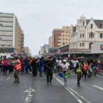 Kugompo Nigerian king protest leaves vehicles burned and shops looted as tensions rise over controversial coronation in South Africa.