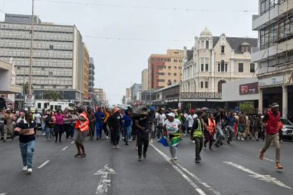 Kugompo Nigerian king protest leaves vehicles burned and shops looted as tensions rise over controversial coronation in South Africa.