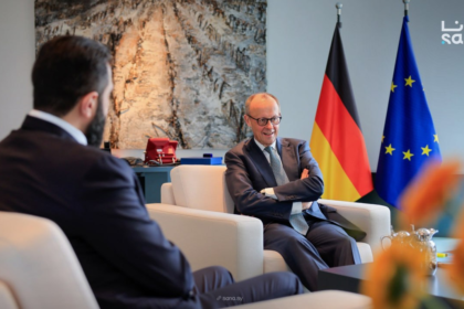 Syria at a Crossroads: Reconstruction, Returns, and Rising Controversy 4 Introduction: A Nation Re-emerging into Global Focus More than a decade after the outbreak of civil war in Syria, the country is once again at the center of international attention. Recent diplomatic developments, economic discussions, and security cooperation efforts suggest a shift in how global powers are engaging with Damascus. At the heart of this renewed focus is the controversial leadership of interim president Ahmed al-Sharaa and a growing willingness from European nations—particularly Germany—to re-engage with Syria politically and economically. This moment reflects a complex intersection of reconstruction ambitions, refugee policies, and geopolitical realities. A Diplomatic Reset: Germany and Syria Rebuild Ties One of the most significant recent developments is Germany’s effort to deepen cooperation with Syria, signaling a notable shift in European foreign policy. German Foreign Minister Johann Wadephul emphasized that Syria holds “enormous” potential as both a market and a production partner. He described the country as a “strategic hub between Europe, the Gulf states and the Indo-Pacific,” highlighting its geographic and economic relevance. This positioning suggests that Syria is no longer viewed solely through the lens of conflict but increasingly as a future economic partner. At a high-level economic forum in Berlin, German officials pledged support for: Rebuilding Syrian state institutions Supporting economic recovery Expanding bilateral trade opportunities Despite ongoing regional instability, Wadephul acknowledged that Syria has managed to prevent broader conflict spillover—calling it “a great success” given tensions across the Middle East. The Al-Sharaa Factor: Leadership, Legitimacy, and Criticism The visit of Ahmed al-Sharaa to Berlin marked a turning point—but also sparked controversy. 4 Al-Sharaa, a 43-year-old former militia leader, has a complex and contentious background. He previously commanded the al-Nusra Front, once linked to extremist networks. His rise to power following the overthrow of Bashar al-Assad in late 2024 has divided international opinion. While some governments see him as a necessary partner for stabilization, critics highlight: Allegations of human rights violations Concerns about minority protection Questions about democratic legitimacy His reception in Berlin reflected this divide. Supporters gathered enthusiastically, chanting “Allahu Akbar,” while protests and political criticism underscored deep unease about legitimizing his leadership. Even within Germany, political and civil society groups remain split. Some argue engagement is essential for peacebuilding, while others warn it risks compromising democratic values. Refugee Returns: Policy, Pressure, and Reality A central issue shaping Germany-Syria relations is the question of refugee repatriation. Germany currently hosts approximately 1 million Syrians, many of whom fled the civil war beginning in 2011. Chancellor Friedrich Merz has proposed an ambitious plan: 80% of Syrians in Germany should return within three years A joint task force will coordinate repatriation efforts Financial support—around €200 million—will assist Syria’s reconstruction However, the policy remains highly controversial. Key Challenges to Repatriation Security concerns: Conditions in Syria are still described as “volatile” Infrastructure damage: Many areas remain heavily destroyed Economic hardship: Limited access to jobs, food, and services Legal risks: Refugees who return may lose protected status abroad Non-governmental organizations have strongly cautioned against forced returns, arguing that safe and dignified conditions are not yet guaranteed. Reconstruction and Economic Opportunity Despite ongoing challenges, Syria is actively positioning itself for reconstruction and investment. Al-Sharaa has framed the country as entering a “new beginning,” emphasizing: Legal reforms to attract foreign investment Opportunities in energy, construction, and technology Efforts to stabilize governance structures Germany and other partners see potential in sectors such as: Infrastructure rebuilding Industrial production IT and software development Energy systems modernization This aligns with broader geopolitical dynamics, where Syria could serve as a logistical and economic bridge between regions. Security Developments: Intelligence and Regional Cooperation Recent events also highlight growing cooperation on security matters. In a notable operation, Turkish intelligence—working with Syrian authorities—captured a fugitive spy at the Syria-Lebanon border after more than a decade on the run. The case underscores: Increasing coordination between regional intelligence agencies Syria’s evolving role in cross-border security Ongoing concerns about espionage and militant networks Such developments suggest that beyond reconstruction, Syria remains a critical player in regional stability and intelligence dynamics. A Fragile Stability in a Volatile Region Despite signs of progress, Syria’s situation remains deeply complex. German officials acknowledge that while conditions have “fundamentally improved,” the broader environment is still unstable. Key risks include: Spillover from regional conflicts (including tensions involving Iran) Internal political fragmentation Ongoing humanitarian challenges Ethnic and sectarian tensions At the same time, Syria has managed—so far—to avoid being drawn into escalating regional conflicts, which some leaders view as a sign of cautious stabilization. What Comes Next: A Critical Turning Point Syria now stands at a pivotal moment. Three parallel trajectories are shaping its future: Reconstruction and economic reintegration Refugee return and demographic shifts Political legitimacy and governance reform The success—or failure—of these efforts will determine whether Syria can transition from a post-conflict state into a stable and functioning nation. Conclusion: Between Opportunity and Uncertainty The re-engagement between Syria and international partners marks a significant shift in global attitudes. Economic cooperation, refugee policy, and security collaboration all point toward a country attempting to rebuild and redefine its role. Yet, the path forward remains uncertain. The leadership of Ahmed al-Sharaa continues to divide opinion, while the realities on the ground challenge optimistic timelines for recovery and repatriation. Syria’s future will depend not only on international support but also on its ability to address internal divisions, rebuild trust, and create conditions for a genuinely inclusive and stable society.