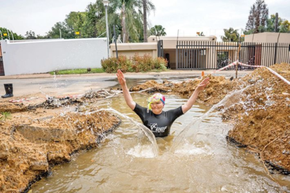 Helen Zille swimming in a pothole goes viral, forcing Joburg to fix a three-year infrastructure issue and raising questions about service delivery.