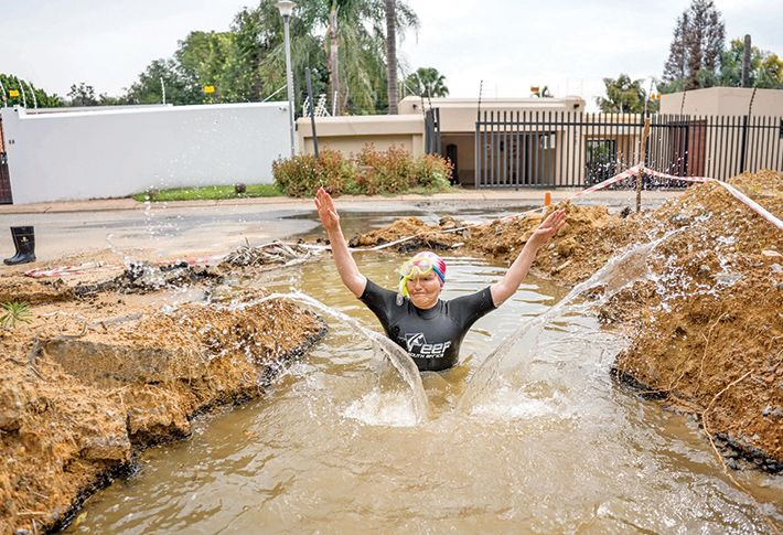 Helen Zille swimming in a pothole goes viral, forcing Joburg to fix a three-year infrastructure issue and raising questions about service delivery.