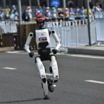 A humanoid robot by Honor wins a half marathon and breaks the human world record, marking a major breakthrough in robotics and AI.
