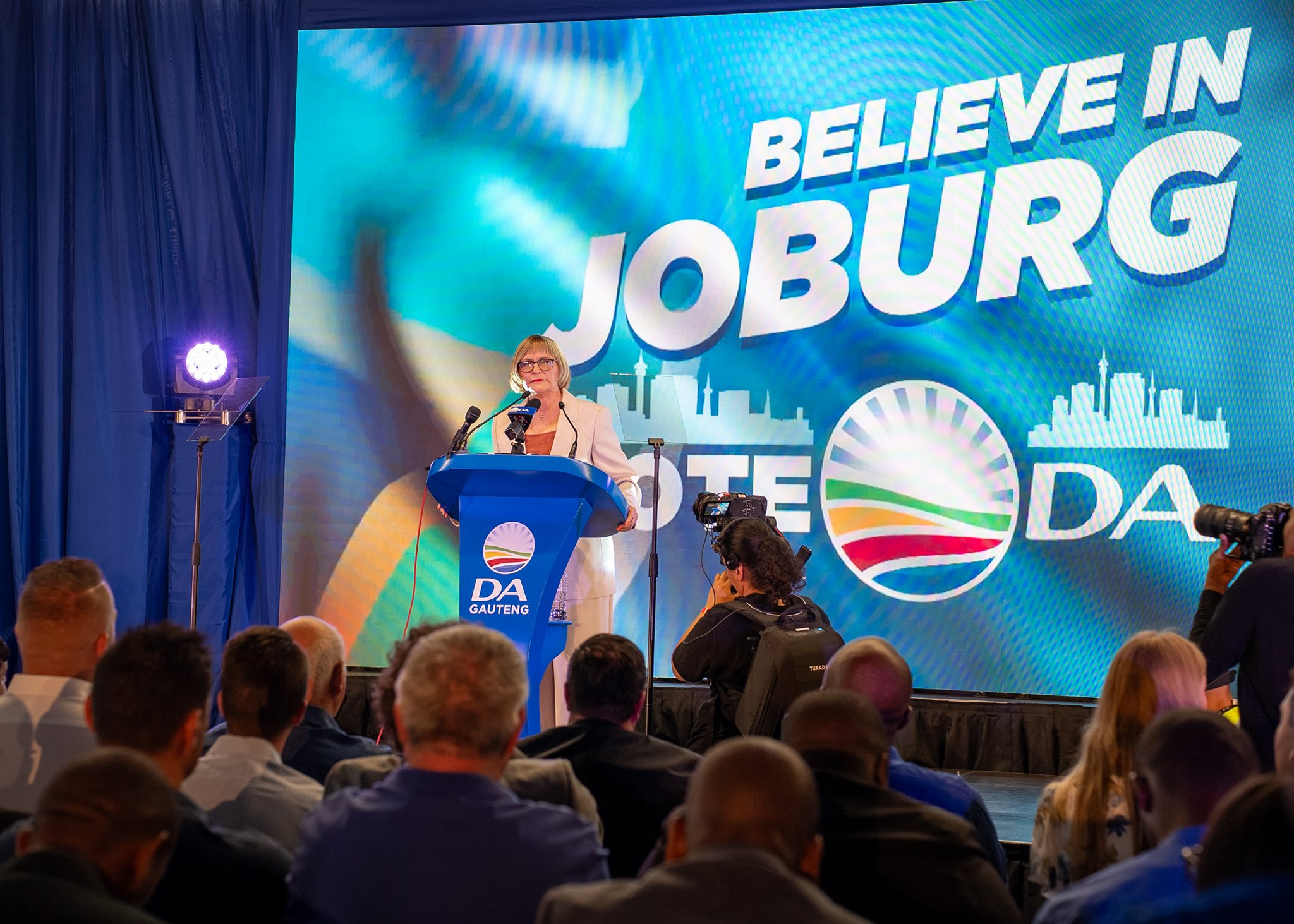 Helen Zille’s pothole swim in Johannesburg sparks debate on infrastructure failures, governance, and the 2026 mayoral race.