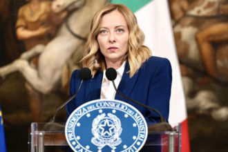Italian Prime Minister Giorgia Meloni faces global pressure over Iran, energy policy, and tensions with Donald Trump in a defining political moment.