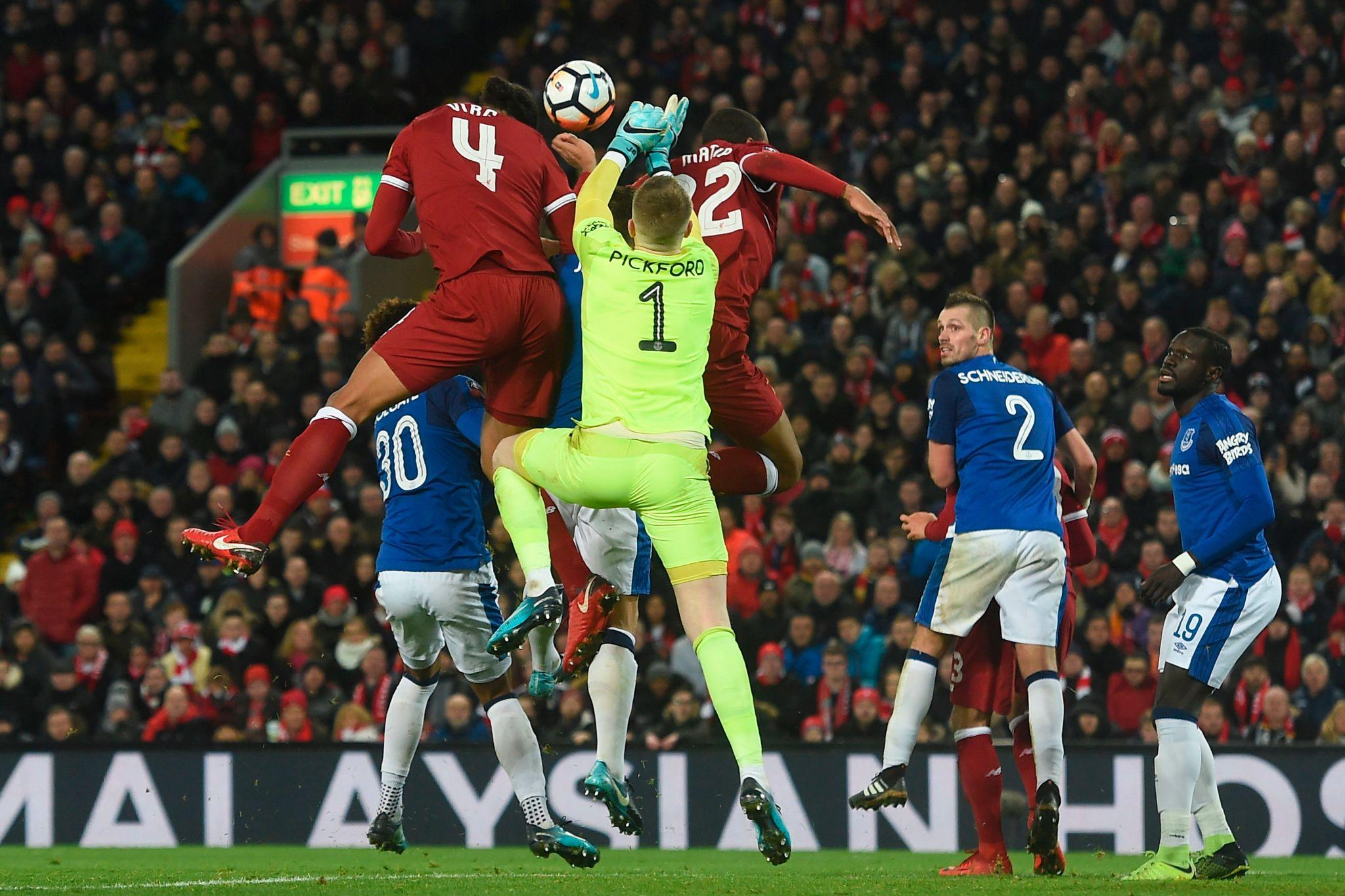 Liverpool beat Everton 2-1 but face goalkeeper concerns. Woodman debut explained with Alisson and Mamardashvili updates.