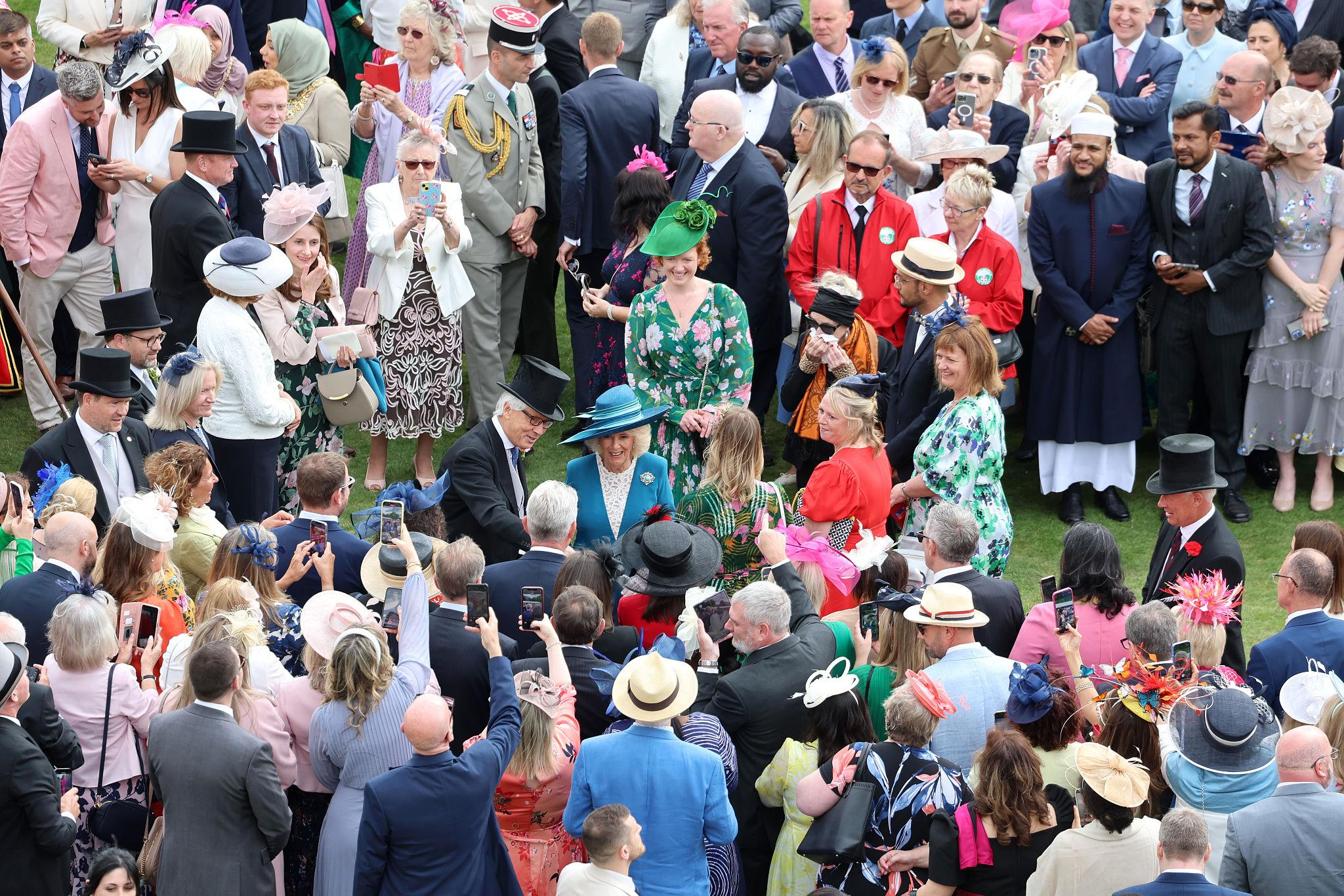 Queen Camilla joined King Charles at Buckingham Palace for a royal garden party celebrating service, tradition and royal style.