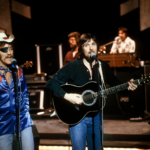 Dennis Locorriere, the legendary Dr. Hook singer, has died at 76 after battling kidney disease. Here’s everything to know about his life and legacy.