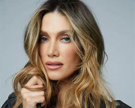Delta Goodrem biography featuring her age, net worth, husband, Eurovision journey, career highlights, family life, and major achievements.