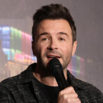Shane Filan and Westlife celebrate 25 years with a new album, global tour, and hints about a future movie biopic.