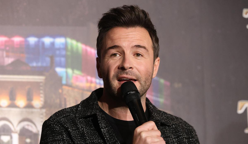 Shane Filan and Westlife celebrate 25 years with a new album, global tour, and hints about a future movie biopic.